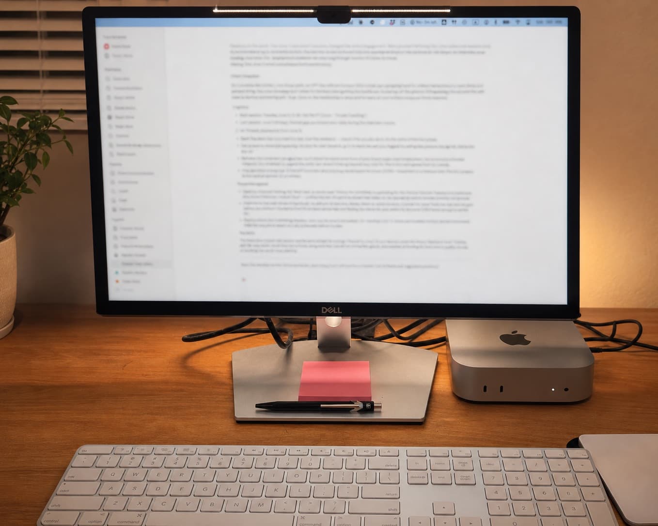 Yoshi's workspace: desk with a monitor showing an AI coaching workflow in progress
